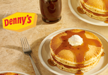 Image shows a short stack of fluffy, buttermilk pancakes alongside a Sweet Cream Cold Brew