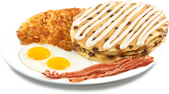 A plate of Get that Cookie Dough Pancakes, hash browns, eggs and bacon.
