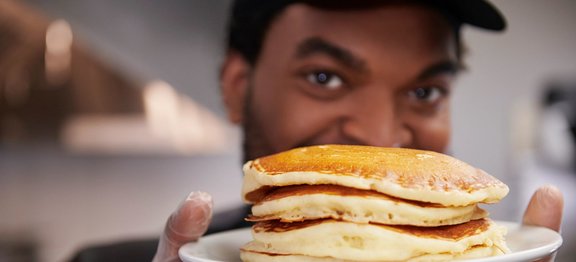 AA Chef with plate of pancakes