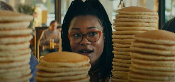 Person looking at stacks of pancakes 