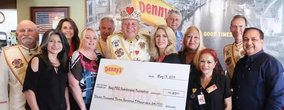 Denny's Franchisees Holding a Big Check
