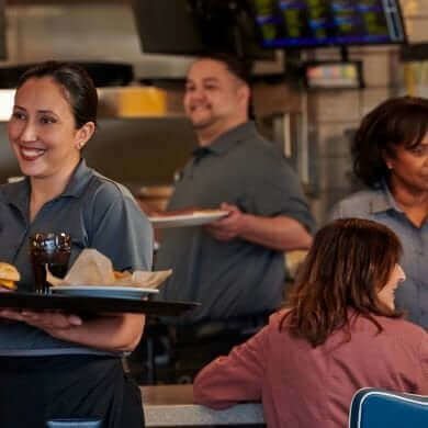 Staff and guests in restaurant